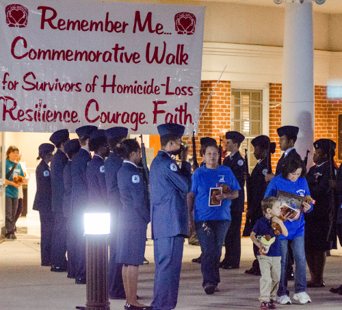 A color guard of junior ROTC cadets honors victims of homicide as their loved ones participate in the 2015 Remember Me Walk. (Photo by David Parks)